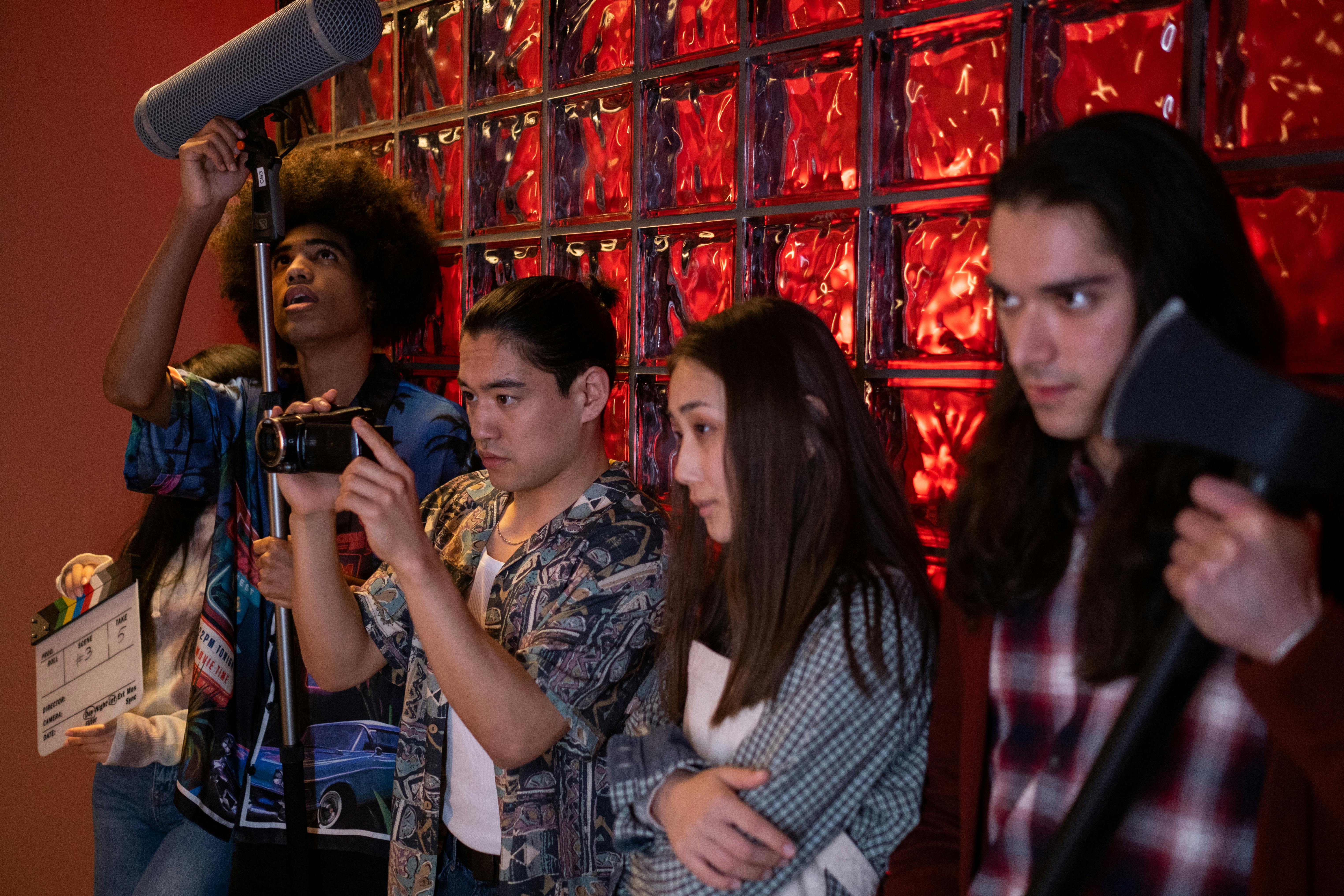 a group of teenagers with filming equipment