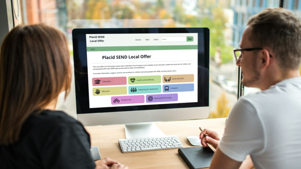 two people looking at Placid on a computer