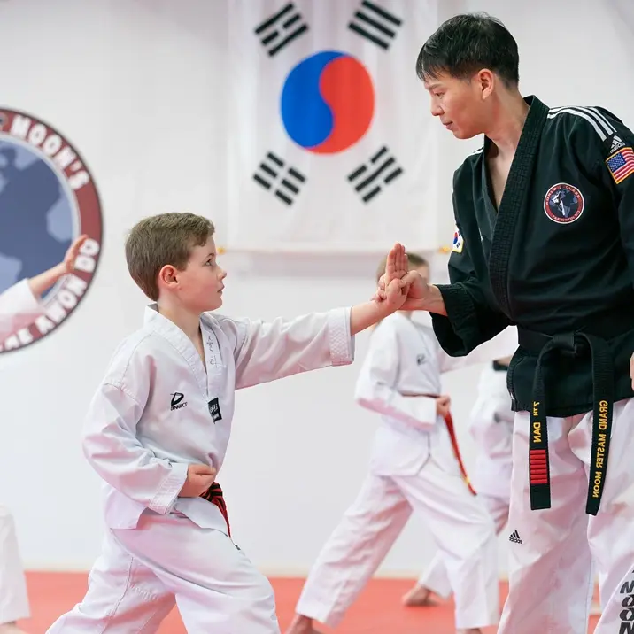 Master Moon working with student